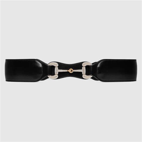 Belt with crystal Horsebit in black leather .